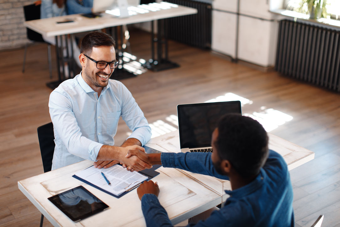 two-business-men-sign-contract Utah business attorneys