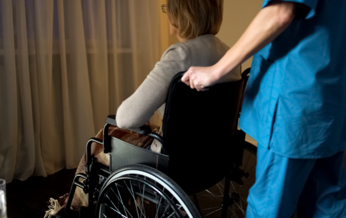 woman in wheelchair with nurse