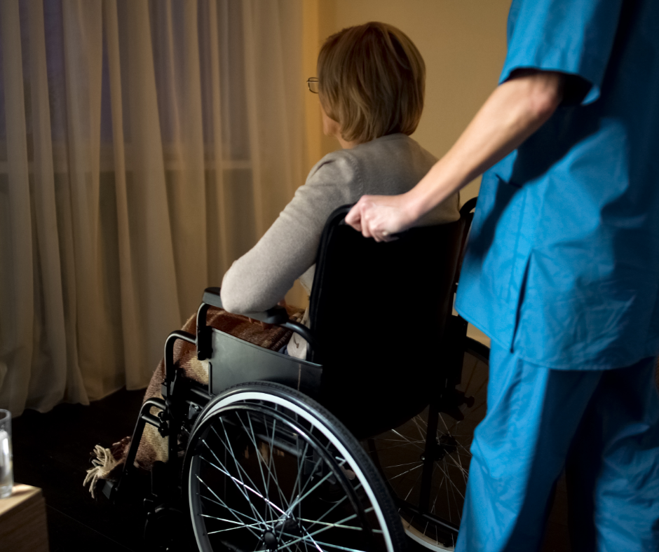 woman in wheelchair with nurse
